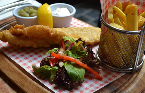 Fresh cod in batter with chips at McNeills of Howth